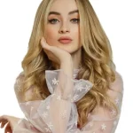 Sabrina-Carpenter-pose-in white top